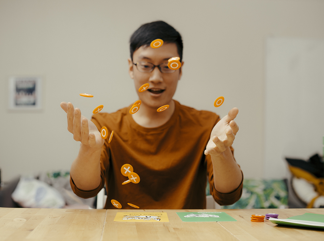 images of someone tossing a bunch of coins in the air